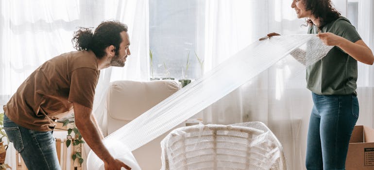 People using packing supplies that they'll reuse packing supplies after moving to Ontario.