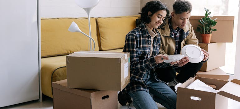 A couple unpacking in their Sudbury ON home.