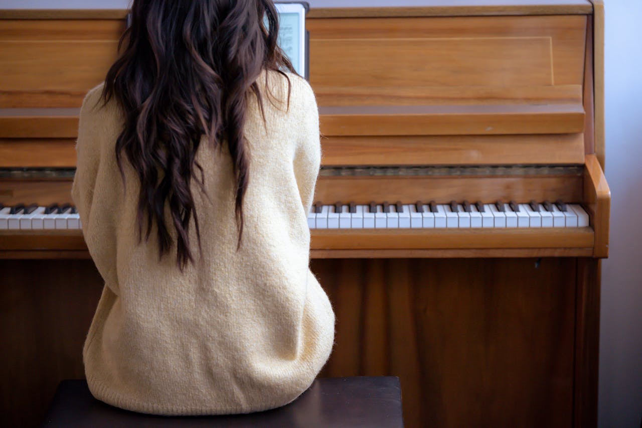 A woman playing the piano.