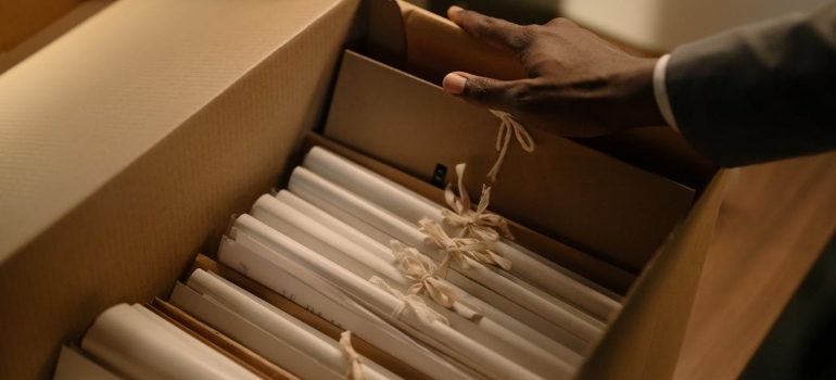 A person organizing files for moving your belongings to the US from Canada.
