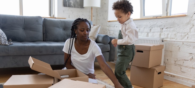 A mom making packing for an international relocation fun for kids.