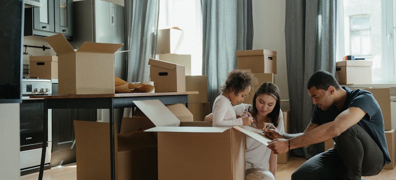 A family drawing on moving boxes while dealing with homesickness when moving from Canada to US.