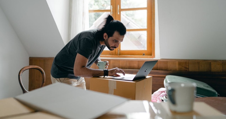 A man researching packing tips.