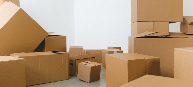 Moving boxes on the floor.