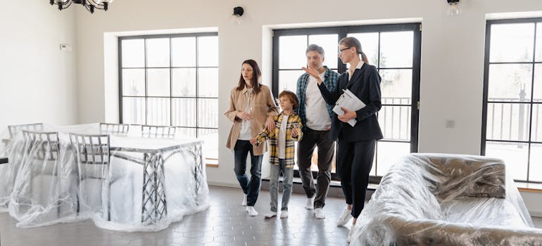 A family moving from an apartment into a house. .