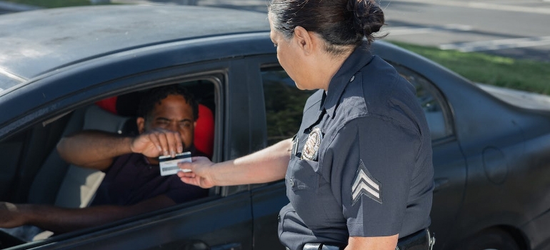 giving driver's license to police